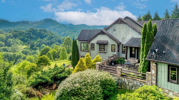 A house with a stone foundation, multiple windows, and a view of a lush green landscape. - Sleeps 22 On 17 Acres, River Access, Pet Friendly (Waynesville)