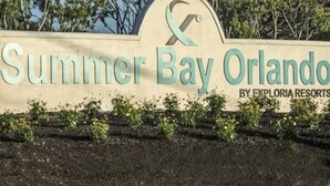 A sign for Summer Bay Orlando by Exploria Resorts. - 3 Free Disney tix! Charming ADA 2-bedroom villa 6 mi. from Disney @ Summer Bay (Clermont)
