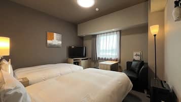 Habitación con 2 camas individuales, para no fumadores | Escritorio, espacio para trabajar con laptop y cortinas blackout