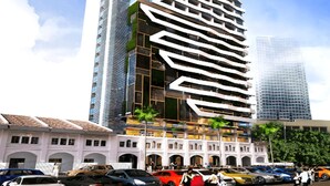 A modern high-rise hotel with a unique zigzag facade, multiple balconies, and a mix of glass and concrete materials. - Maison 101 Residence walk to Menara KL (Kuala Lumpur)