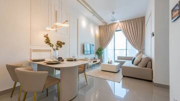 Superior Apartment, 3 Bedrooms, Balcony, City View | Living area | 35-inch TV with cable channels