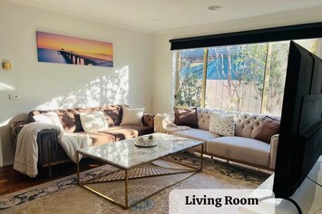 Living Room #1 with two Sofa Beds, TV, and AirCon