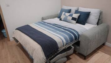 1 bedroom, desk, iron/ironing board, travel crib