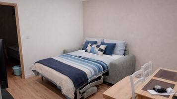 1 bedroom, desk, iron/ironing board, travel crib