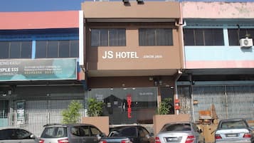 A hotel with a sign reading 'JS HOTEL JOHOR JAYA' and a visible entrance.