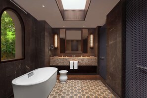 Ein modernes Badezimmer mit einer freistehenden Badewanne, einem großen Spiegel und einem beflorten Boden.