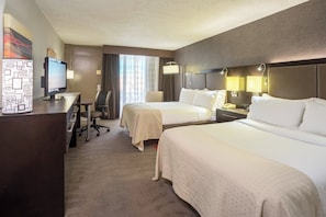 A hotel room with two beds, a desk, a television, and a chair. - Holiday Inn Harrisburg - Hershey Area, I-81 by IHG (Grantville)