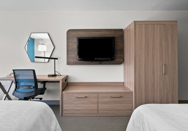 A hotel room with a bed, a desk with a chair, a television mounted on the wall, and a wardrobe. - Holiday Inn Express & Suites West Point - Fort Montgomery (Fort Montgomery)