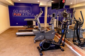 A gym with a treadmill, elliptical, and stationary bikes. - Holiday Inn Express & Suites Torrington (Torrington)