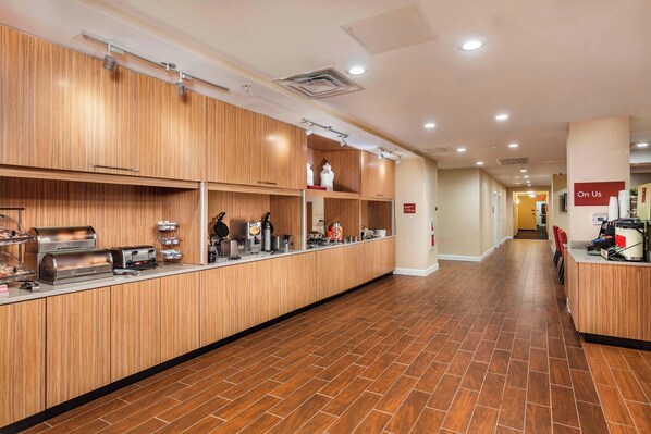 A long, narrow hotel corridor with wooden paneling on the walls and a tiled floor. - Towneplace Suites by Marriott Orlando Altamonte Springs/maitland (Altamonte Springs)