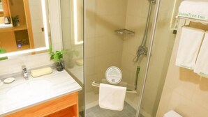 A modern bathroom with a glass shower enclosure, a wooden vanity, and a toilet. - Greentree Inn Shangqiu Suiyang Avenue Hotel (Shangqiu)