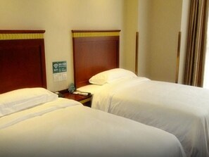 A hotel room with two beds, a nightstand, and a sign indicating Wi-Fi availability. - Greentree Inn Beijing Daxing Xingye Street Liyuan Business Hotel (Daxing)