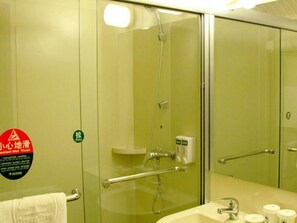 A bathroom with a glass partition, a shower, a sink with a mirror, and a towel rack. - Greentree Inn Beijing Daxing Xingye Street Liyuan Business Hotel (Daxing)