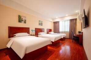 A hotel room with three beds, a desk, a chair, and a television. - Greentree Inn Shandong Rizhao Juxian Yinxing Avenue Middle Shandong Road Business Hotel (Rizhao)