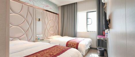 A hotel room with two beds, a large window, a flat-screen TV, and a minibar.