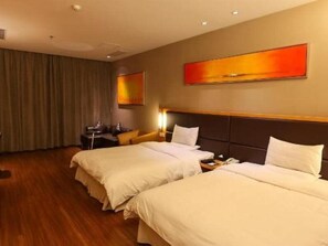 A hotel room with two beds, a desk, and a large window with curtains. - Ji Hotel (Hangzhou)