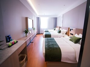 A hotel room with two beds, a desk, a mirror, and a window with curtains. - Greentree Inn Tangshan Nanhu International Exhibition Center (Tangshan)
