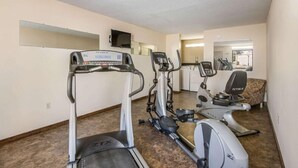 A fitness room with treadmills, an elliptical, and a stationary bike. - Rodeway Inn & Suites Dublin, GA (East Dublin)