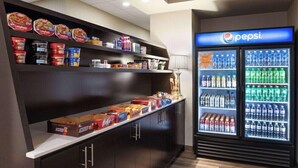A self-service food station with various food items and a Pepsi refrigerator. - La Quinta Inn & Suites by Wyndham Wenatchee (Wenatchee)