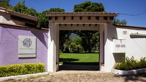 A building entrance with a sign reading "Casa Flor de Mayo Matamoros 99a". - Casa Flor de Mayo (Tepoztlán)