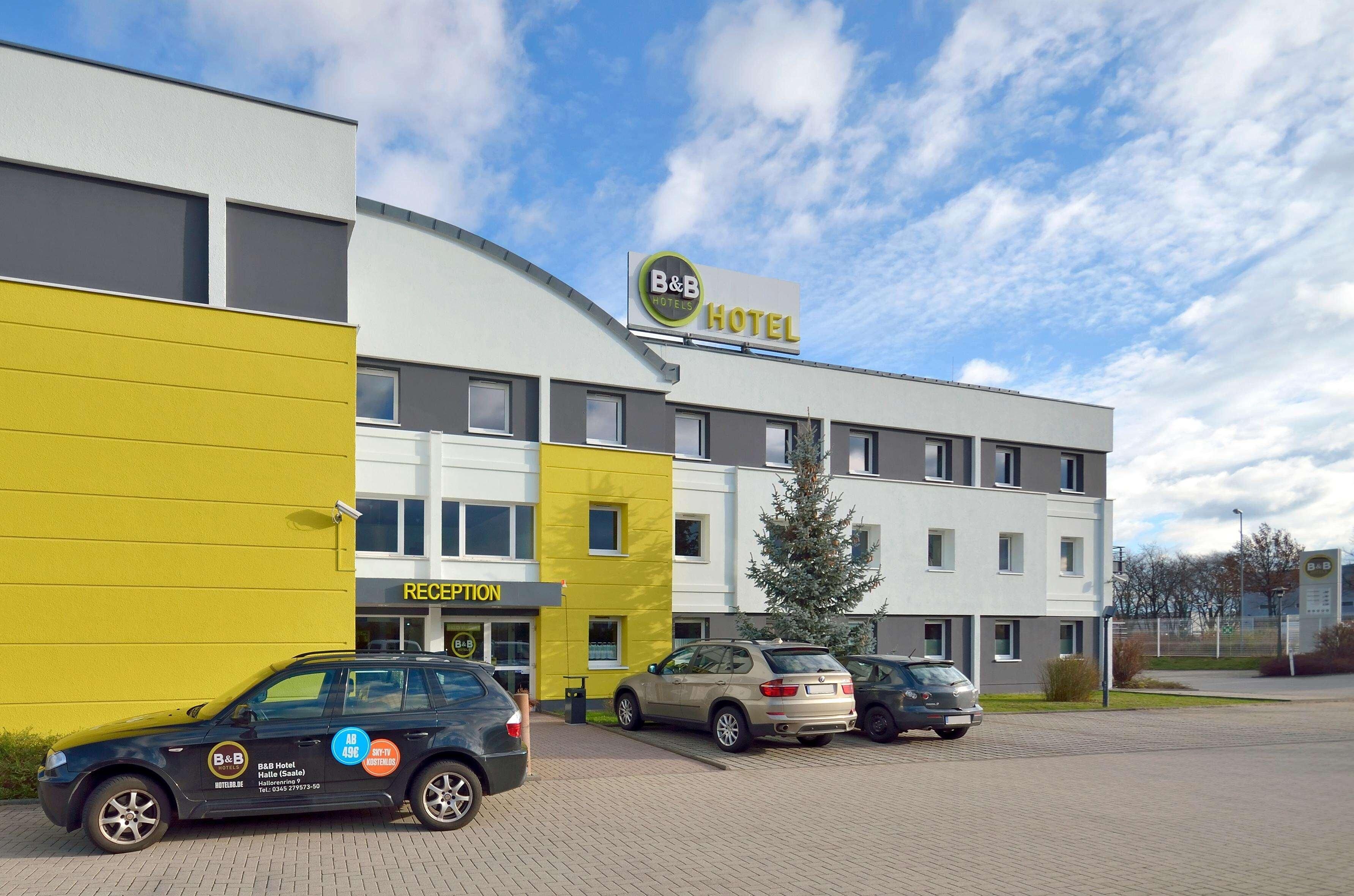 A B&B Hotel with a reception area, parking, and a modern building facade.