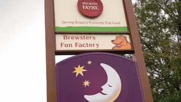 A sign for Afon Conwy and Premier Inn.
