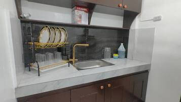 Fridge, coffee/tea maker, cookware/dishes/utensils