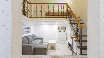 Apartment (1 Bedroom) | Living area | 32-inch TV with cable channels