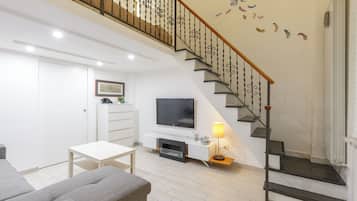 Apartment (1 Bedroom) | Living area | 32-inch TV with cable channels