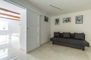 Apartment (1 Bedroom) | Living area | 32-inch Smart TV with cable channels