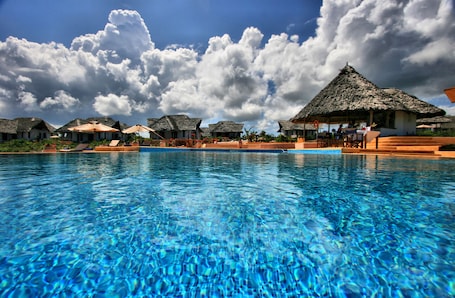 Outdoor pool, pool umbrellas, sun loungers