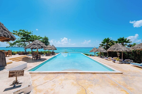 Outdoor pool, pool umbrellas, pool loungers