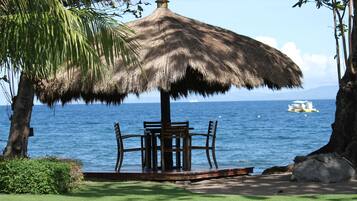 On the beach, sun loungers, beach towels, beach bar