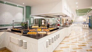 A buffet area with various food items and a sign labeled "Tapas". - Grupotel Playa Club (Ciutadella de Menorca)