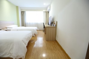 A hotel room with two beds, a desk with a computer, and a large window with curtains. - Hanting Hotel (Hangzhou)