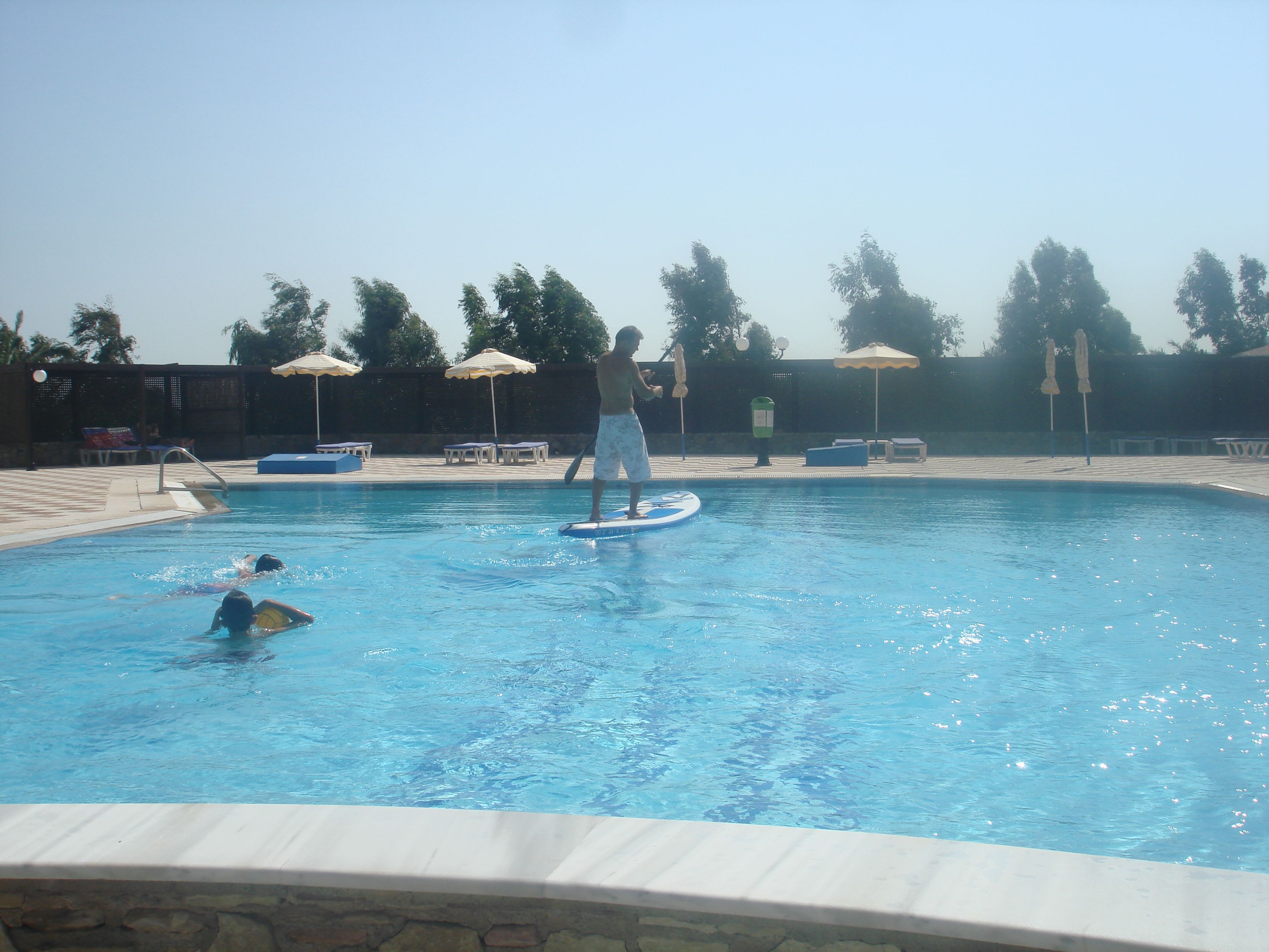 outdoor pool, pool umbrellas, pool loungers