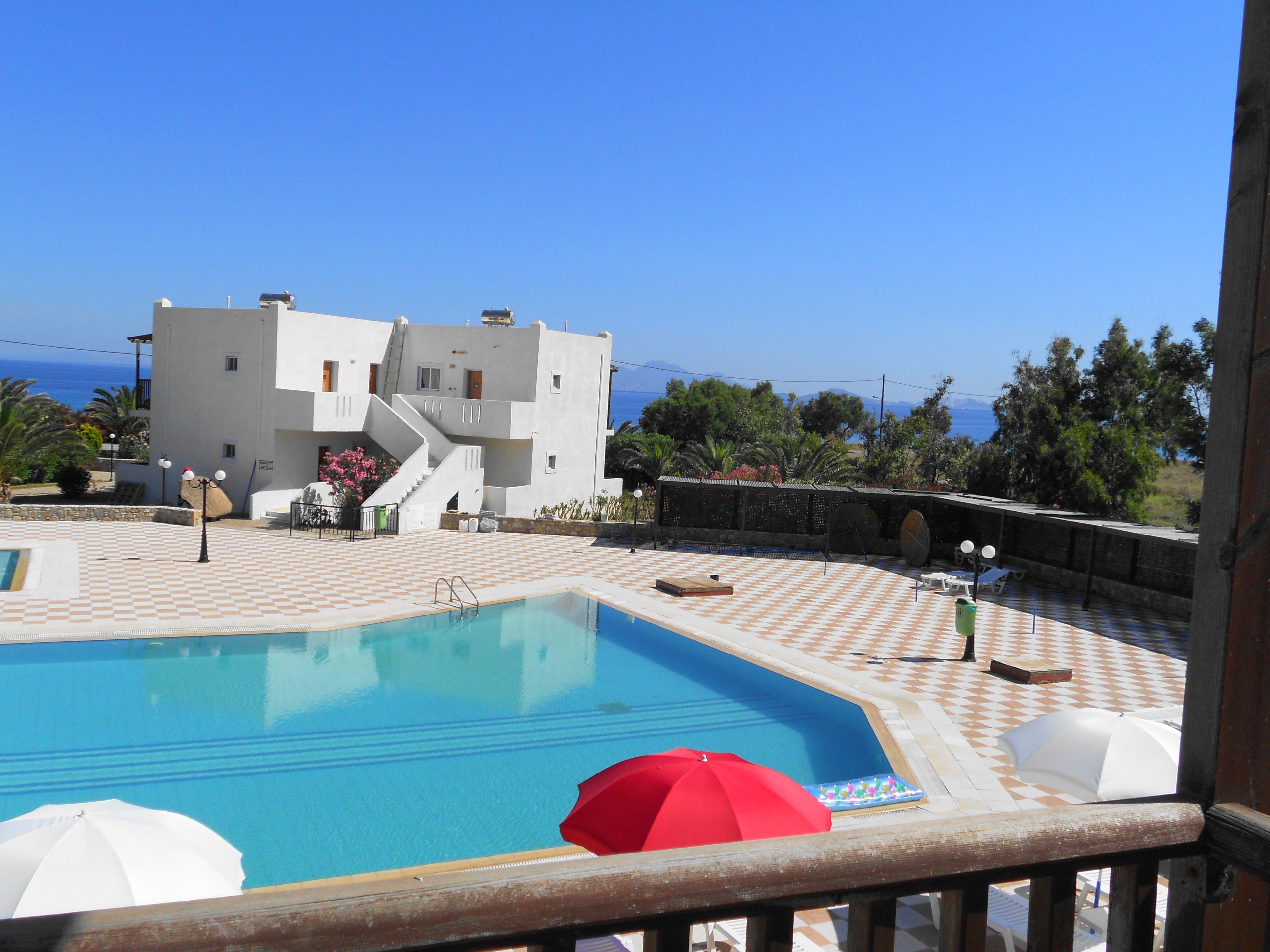 outdoor pool, pool umbrellas, pool loungers