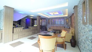 A spacious living area with a kitchen, dining area, and a staircase leading to an upper level. - North Centre (Kanayannur)