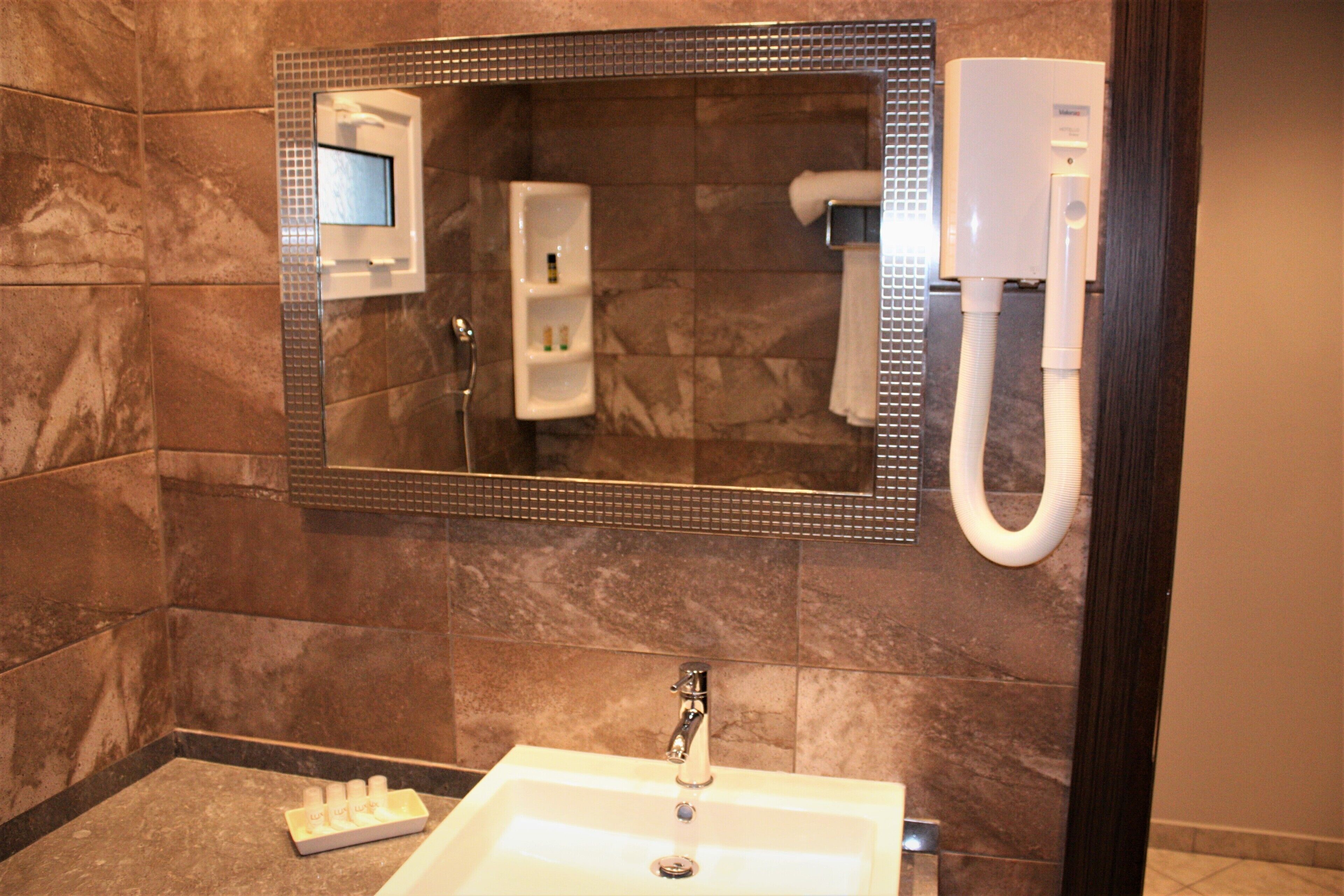 superior triple room | bathroom | hair dryer, towels
