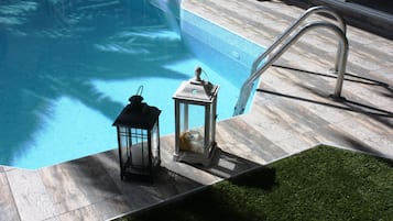 Seasonal outdoor pool, pool loungers