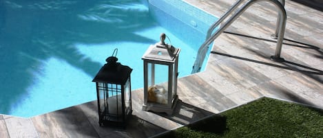 Seasonal outdoor pool, pool loungers