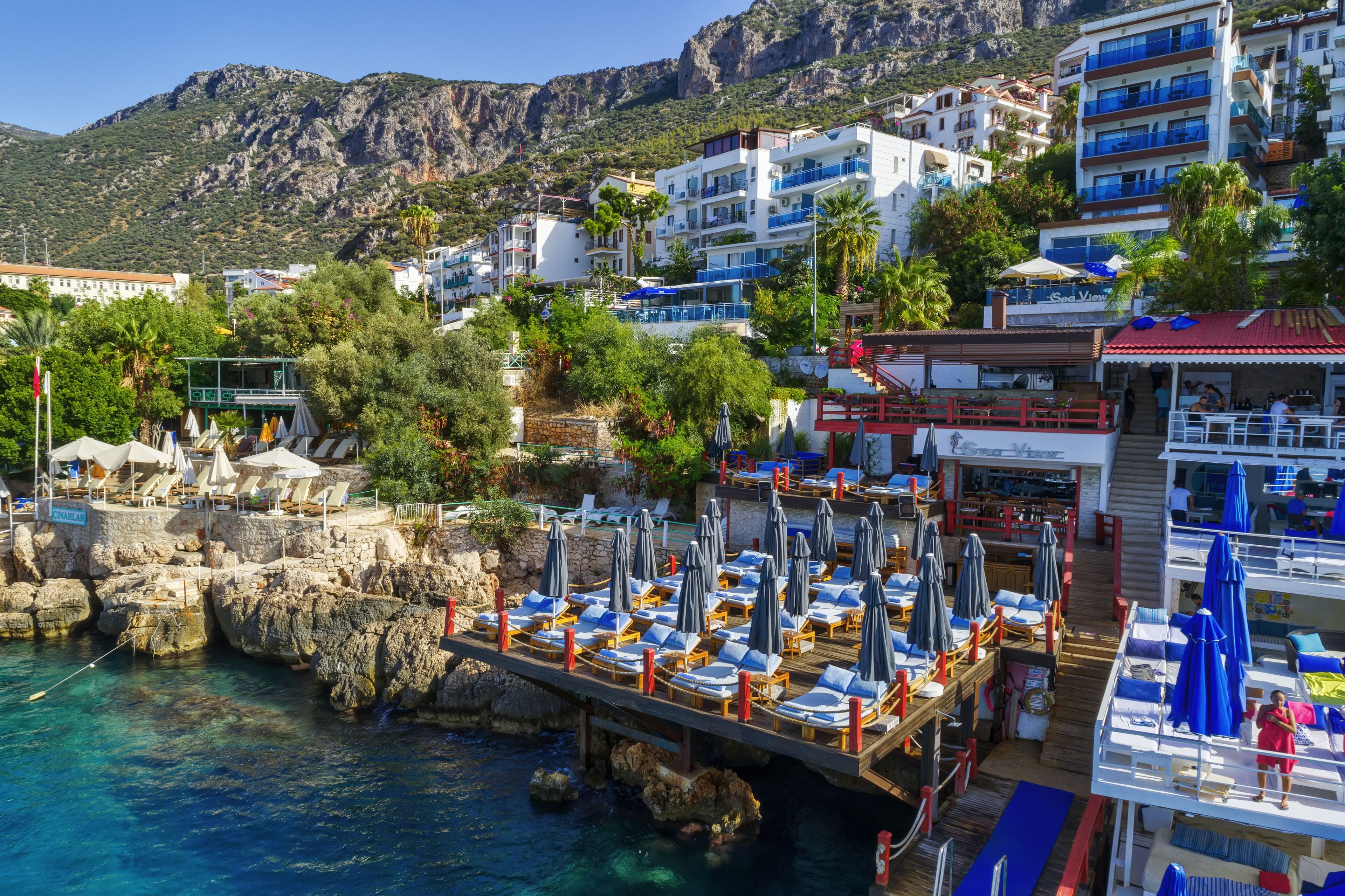 sun-loungers, beach umbrellas, beach towels, beach bar