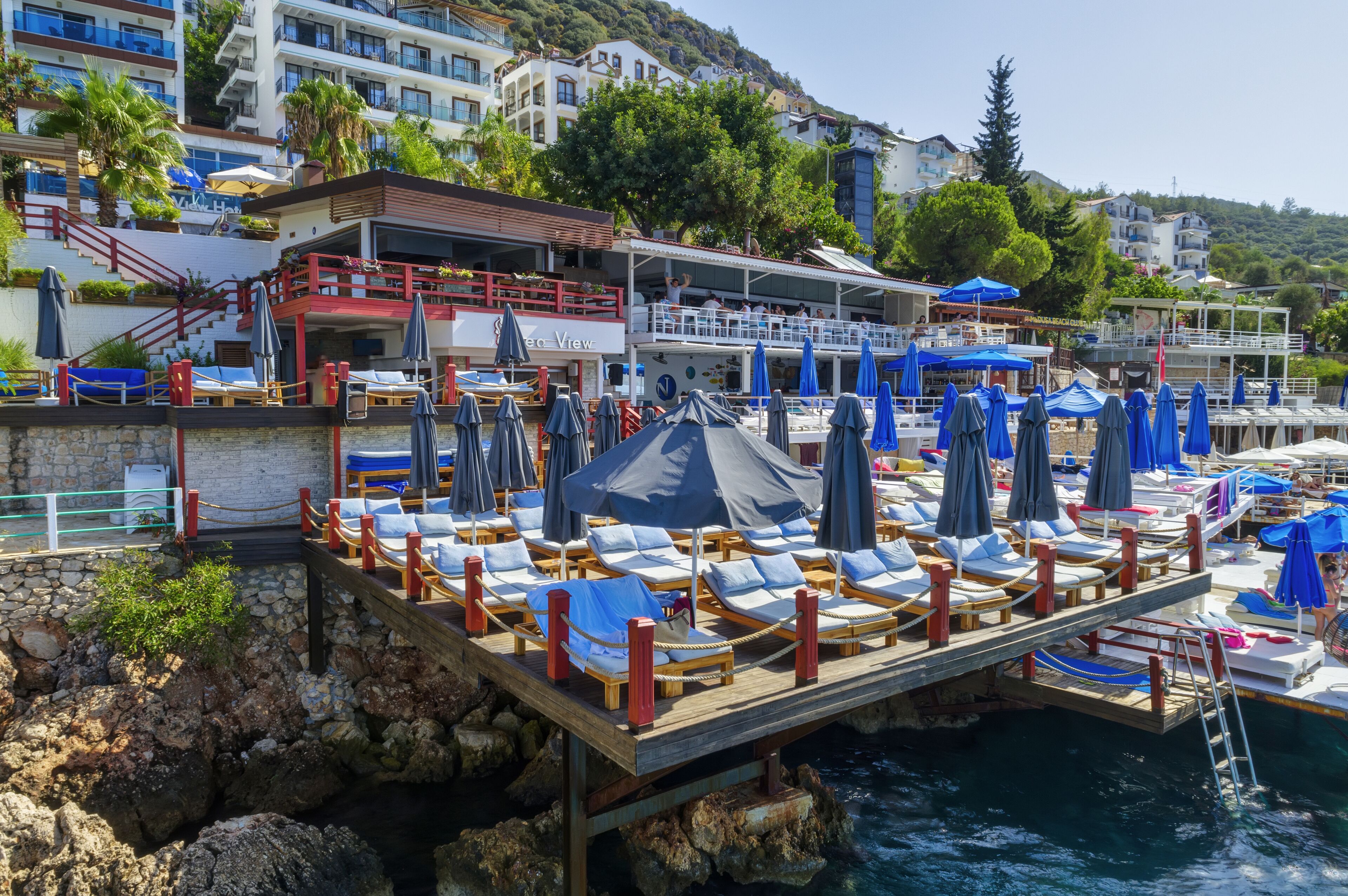 sun-loungers, beach umbrellas, beach towels, beach bar