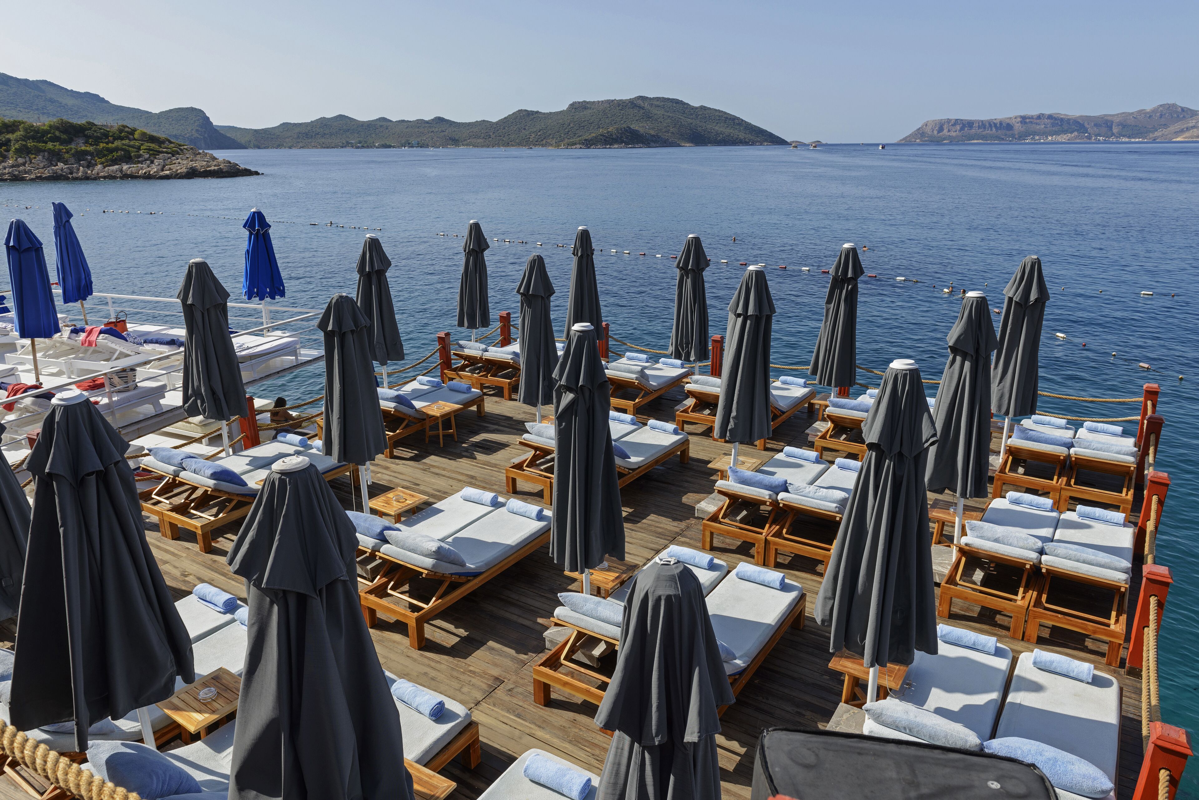 sun-loungers, beach umbrellas, beach towels, beach bar