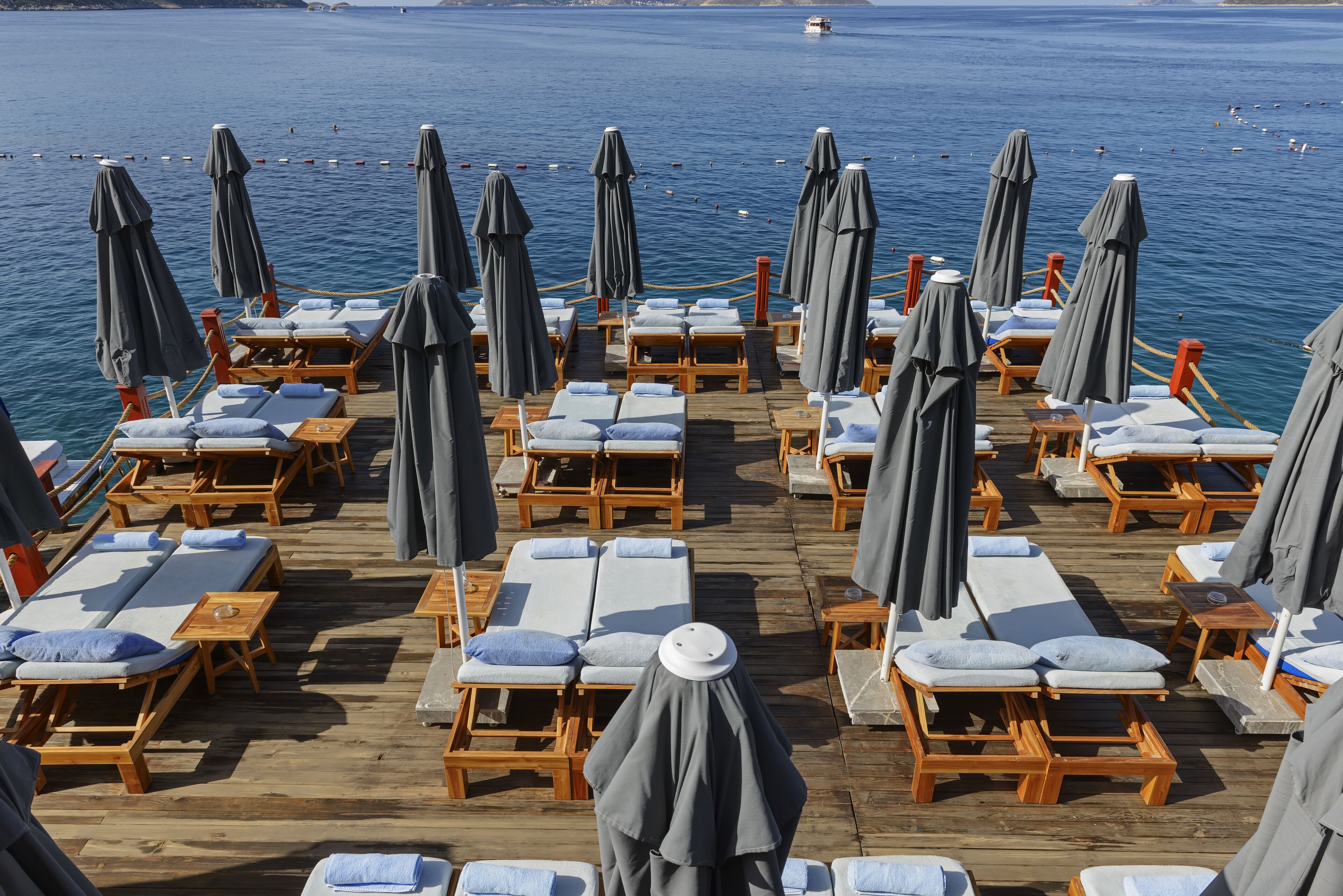 sun-loungers, beach umbrellas, beach towels, beach bar