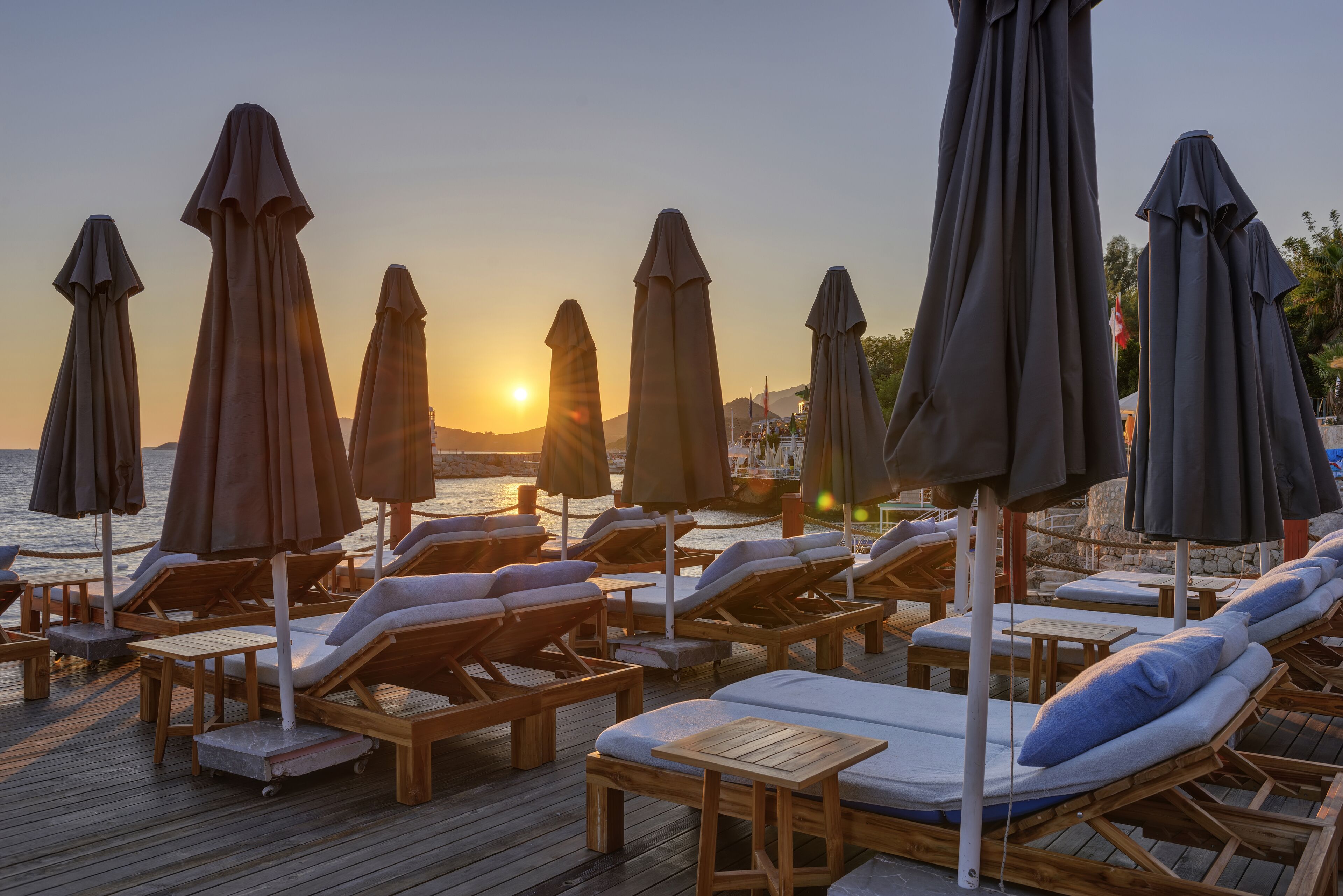 sun-loungers, beach umbrellas, beach towels, beach bar