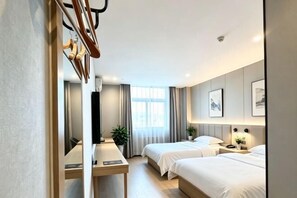 A hotel room with two beds, a mirror, a desk, and a window with curtains. - GreenTree Smart Choice Hotel (Beijing Liangxiang Nanguan Subway Station) (Beijing)