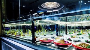 A buffet with various dishes displayed in glass cases. - Jiehui Hotel (Shanghai)