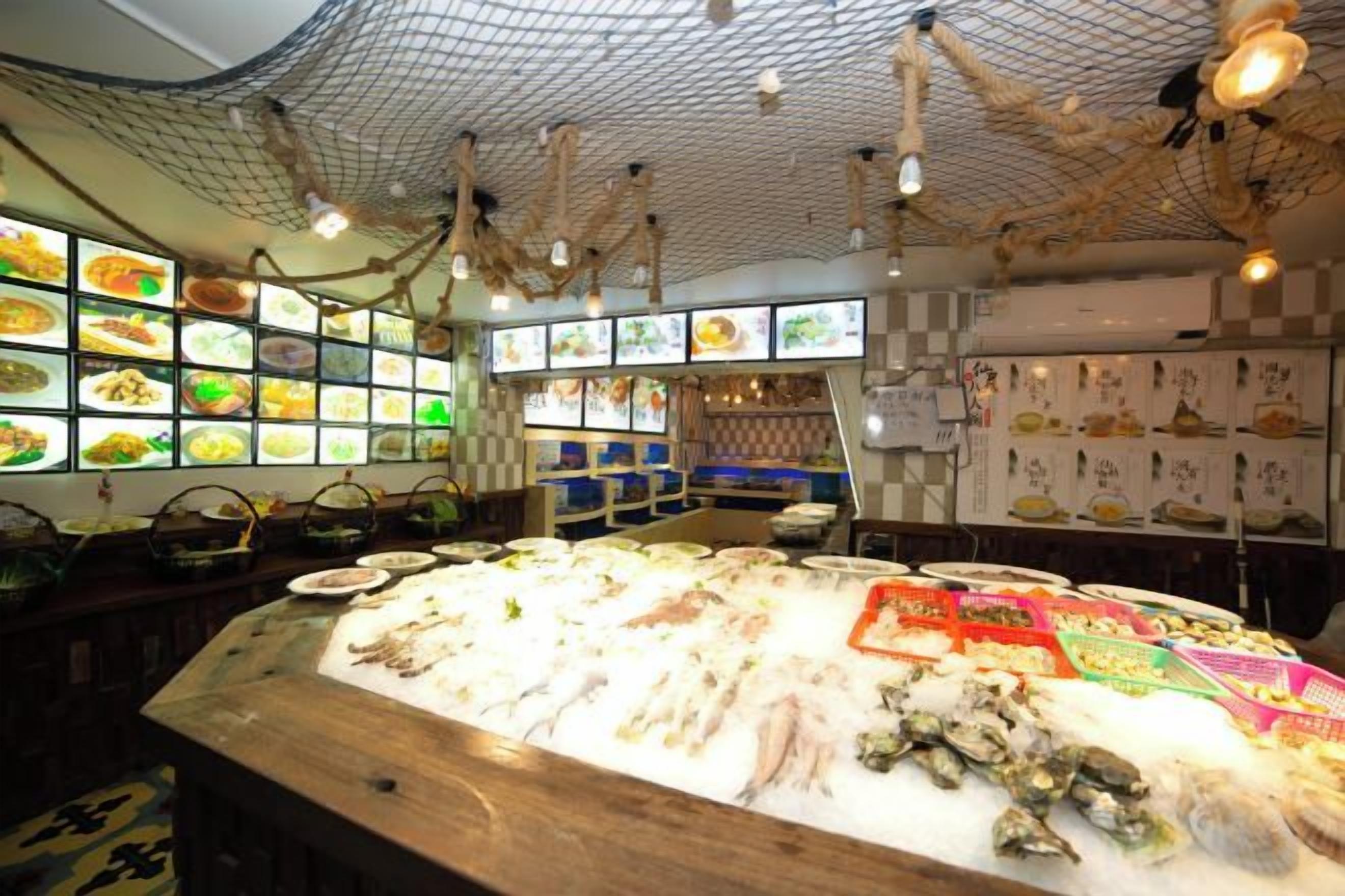 A seafood display with various types of fish and seafood.