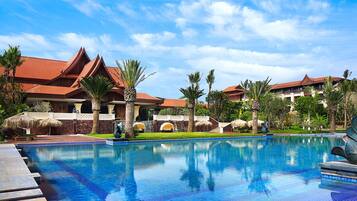 Indoor pool, outdoor pool, pool umbrellas, pool loungers